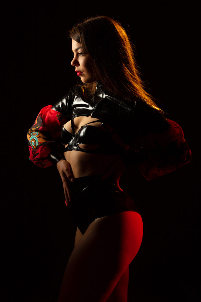 Model Axelle Sparsely Lit Wearing Latex by Zorenko London and Lüllepop